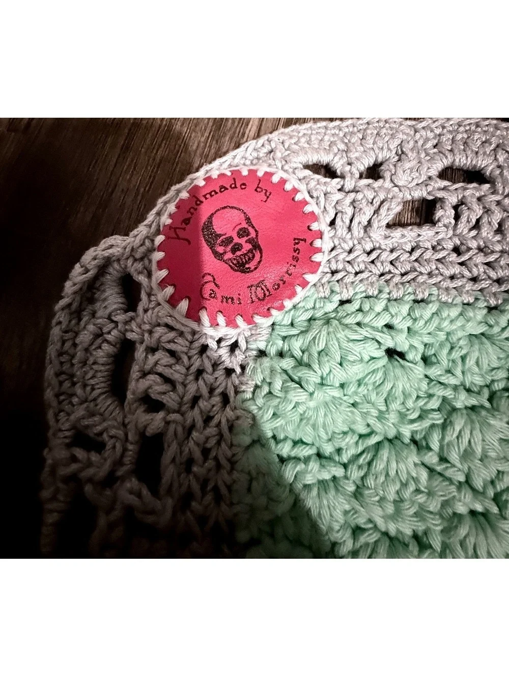Handmade baby blanket signed by crafter with logo